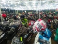 Salatiga, Indonesia - March 2023: Parking lot full of motorbikes at night with bright lights