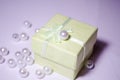 Salatne box with a pearl. Bead on the box. Plastic bead. Placer beads. White beads.