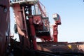 screw type ship unloader boom discharging cargo from ship's hold