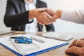 Sale agent handshake deal to agreement successful car loan contract with customer and sign agreement contract Insurance car Royalty Free Stock Photo