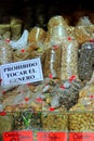 Bags of dried fruit on the market counter with sign of no touching