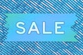 Sale blue wood sign on blue and white sparkle ribbon