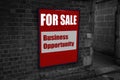 For sale with business opportunity written on a sign attached to a wall