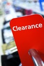 Sale Clearance Sign On Rail in Clothes Shop Royalty Free Stock Photo