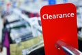 Sale Clearance Sign On Rail in Clothes Shop Royalty Free Stock Photo