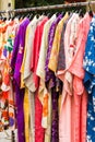 Sale of colorful kimonos on the city street in Kyoto, Japan. Close-up. Vertical. Royalty Free Stock Photo