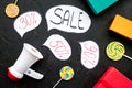 Sale concept with megaphone. Declare the sale. Electronic megaphone near word sale in cloud, gift boxes and sweets on