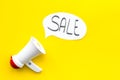 Sale concept with megaphone. Declare the sale. Electronic megaphone near word sale in cloud on yellow background top