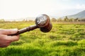 Sale concept,wooden gavel on green grass background Royalty Free Stock Photo