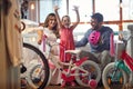 Sale, consumerism and people concept - happy family with child and shopping new bicycle Royalty Free Stock Photo