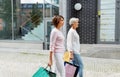 Senior women with shopping bags walking in city Royalty Free Stock Photo