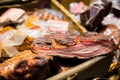 Smoked meat products at market or butcher shop Royalty Free Stock Photo