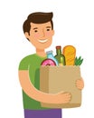 Sale of food. Young man holding paper bag with foodstuffs