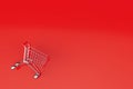 sale of goods at a bargain price. cart for groceries on a red background. copy paste, copy space. 3d render Royalty Free Stock Photo