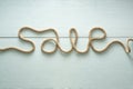 Sale inscription is written using a rope made of jute