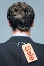 Sale label on the back of a mans jacket