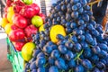 Sale of large blue grapes on the market counter Royalty Free Stock Photo