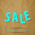 SALE letters mint on a crumpled paper brown background.