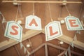 Sale Letters Signs Hanging on The Ceiling