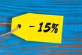 Sale minus 15 percent. Big sales fifteen percents on blue wooden background for flyer, poster, shopping, sign, discount