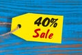 Sale minus 40 percent. Big sales fourty percents on blue wooden background for flyer, poster, shopping, sign, discount