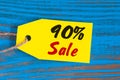 Sale minus 90 percent. Big sales ninety percents on blue wooden background for flyer, poster, shopping, sign, discount