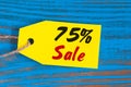 Sale minus 75 percent. Big sales seventy five percents on blue wooden background for flyer, poster, shopping, sign