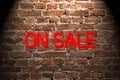 on sale neon sign on brick wall