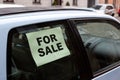 For sale. old dirty car on the street with inscription in the window Royalty Free Stock Photo