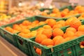 Sale of oranges in the supermarket. Citrus fruits in plastic boxes