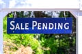 Sale Pending real estate sign near purchased house during red hot seller`s market in the desired residential neighborhood