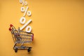 Sale Percents Falling Into Shopping Cart Royalty Free Stock Photo