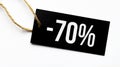 SALE 70 percents text on a black tag on a white paper background Royalty Free Stock Photo