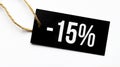 SALE 15 percents text on a black tag on a white paper background Royalty Free Stock Photo