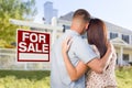 For Sale Real Estate Sign, Military Couple Looking at House Royalty Free Stock Photo