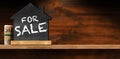 For Sale Real Estate Sign on a Wooden Table with Copy Space Royalty Free Stock Photo