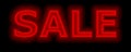 Sale red neon sign promoting sales