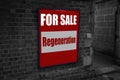 For sale with regeneration written on a sign attached to a brick