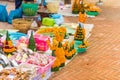 Sale of sacrificial offerings from banana leaves and flowers, Luang Prabang, Laos. Copy space for text.