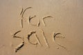 For Sale in sand Royalty Free Stock Photo