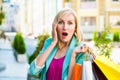 Sale, shopping, tourism and happy people concept - beautiful woman with shopping bags in the ctiy Royalty Free Stock Photo