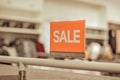 Sale sign in a clothing store Royalty Free Stock Photo