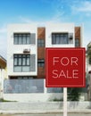 For sale sign in front of an affordable three storey apartment building. A medium density residential building on the real estate Royalty Free Stock Photo