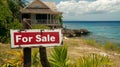 For Sale Sign in Front of a Beach House Royalty Free Stock Photo