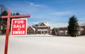 For sale sign in front of large USA home Royalty Free Stock Photo
