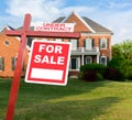 For sale sign in front of large USA home Royalty Free Stock Photo