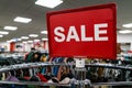 Sale Sign On Rail in Clothes Shop Royalty Free Stock Photo