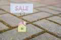 Sale sign with small model house - real estate buying concept.Copy space. home and life concept. Small model home with Royalty Free Stock Photo