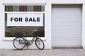 For sale sign in store window with bicycle parked outside - shop vacancy Royalty Free Stock Photo