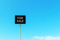 For sale signage against blue sky Royalty Free Stock Photo